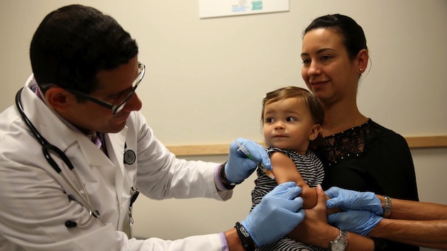 mother-with-child-retro-measles-vaccine