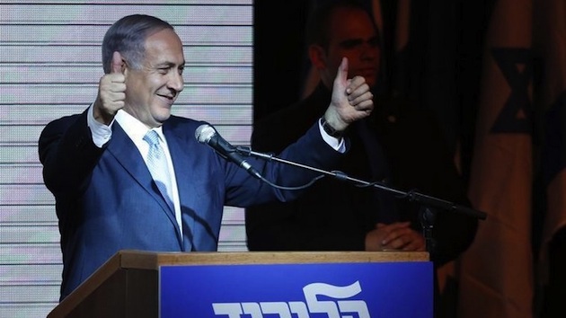 Israeli Prime Minister Netanyahu gestures to supporters at party headquarters in Tel Aviv