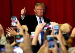 U.S. Republican presidential candidate Donald Trump greets supporters as he arrives to appear with New Jersey Governor Chris Christie at a fundraising event in Lawrenceville