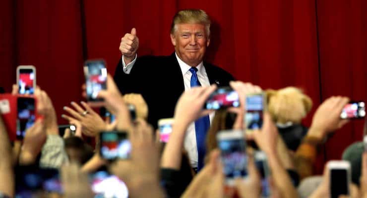 U.S. Republican presidential candidate Donald Trump greets supporters as he arrives to appear with New Jersey Governor Chris Christie at a fundraising event in Lawrenceville