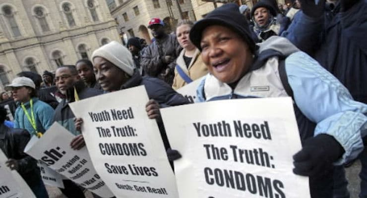 Condoms will be distributed at a Brooklyn school prom this year, but will it encourage safer teenage sex? Protesters demonstrate outside Philadelphia's City Hall on March 10, 2004. Public health advocates staged the rally to criticize President Bush's plan to expand abstinence-only education, which protesters said actually hurts sexually active teens. (Photo: AP)