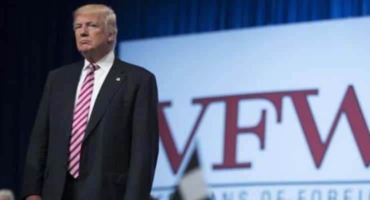 Republican presidential candidate Donald Trump waits as he is introduced during a Veterans of Foreign Wars convention, on July 26 in Charlotte, N.C. (Photo: Evan Vucci/AP)