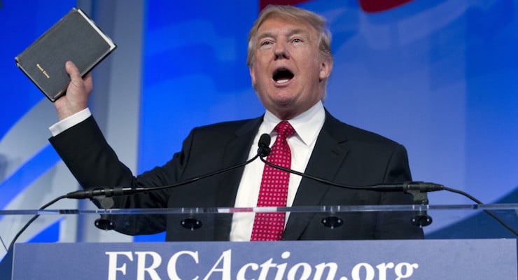 Donald Trump, holds up his Bible as he speaks during the Values Voter Summit Sept. 25 in Washington (Photo: AP/Jose Luis Magana)