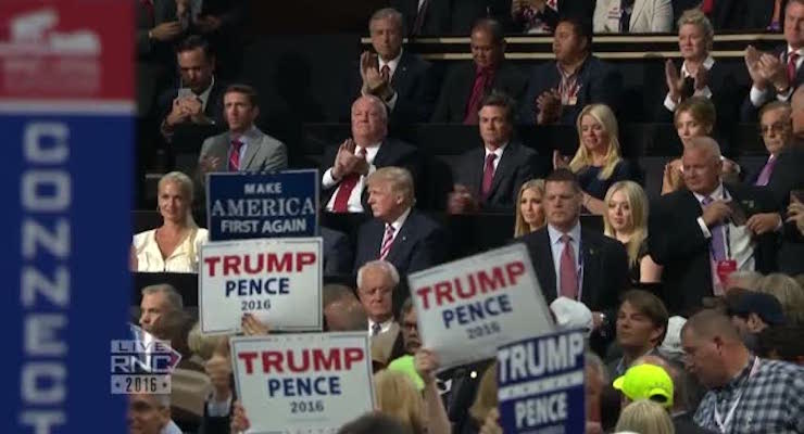 Donald Trump watches his son Eric Trump address the Republican National Convention at the Quicken Loans Arena in Cleveland, Ohio.