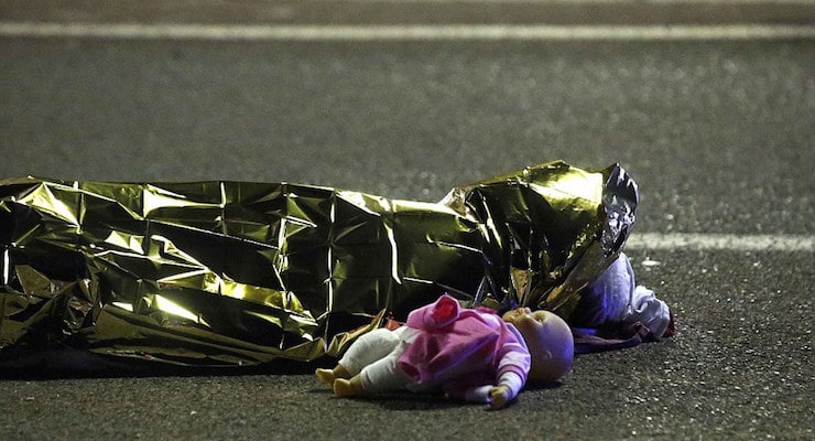 A child's doll lies on the street beside the body of a young girl who was killed in last night's attack in Nice, a city in the south of France. (Photo: Reuters)