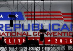 A Republican National Convention logo is seen though silhouetted production equipment on a huge video screen at Quicken Loans Arena for the Republican National Convention, Sunday, July 17, 2016, in Cleveland. (AP Photo/Carolyn Kaster)