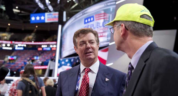 Trump Campaign Chairman Paul Manafort talks to delegates as he walks around the convention floor at the Quicken Loans Arena in Cleveland, Ohio. (Photo: AP)