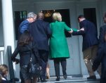 Democratic presidential candidate Hillary Clinton is helped up stairs in a photo captured by Reuters. (PHOTO: REUTERS)