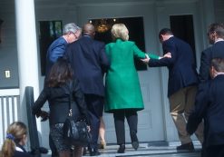 Democratic presidential candidate Hillary Clinton is helped up stairs in a photo captured by Reuters. (PHOTO: REUTERS)