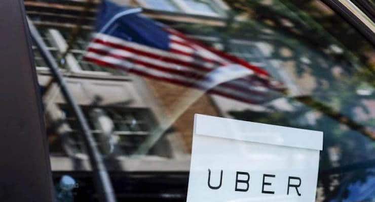 An Uber sign is seen in a car in New York June 30, 2015. (PHOTO: REUTERS)