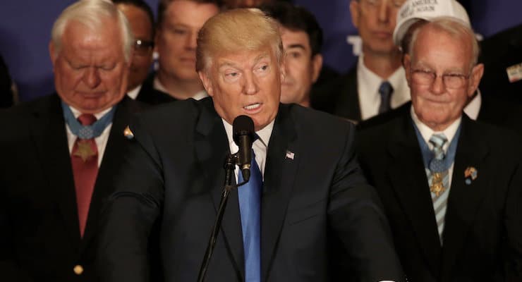 Flanked by two Medal of Honor recipients, Republican presidential candidate Donald Trump delivers remarks at a campaign event at the Trump International Hotel in Washington, D.C., U.S., September 16, 2016. (PHOTO: REUTERS/Mike Segar)