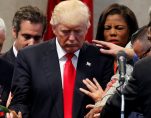 Members of the clergy lay hands and pray over Republican presidential nominee Donald Trump at the New Spirit Revival Center in Cleveland Heights, Ohio, U.S., September 21, 2016. (Jonathan Ernst/Reuters)