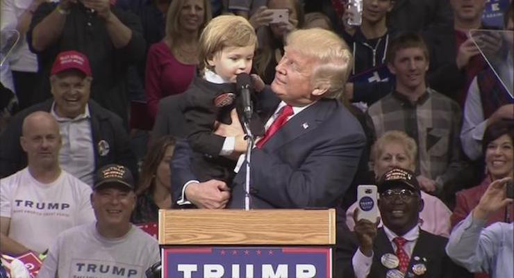 Donald Trump with mini-Trump at a rally in Wilkes-Barre, PA.