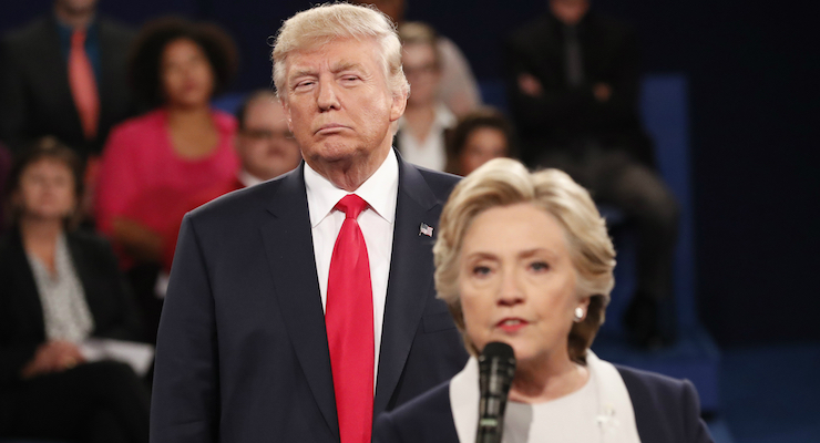 Republican presidential nominee Donald Trump looks on as Democratic presidential nominee Hillary Clinton answers a question during the second presidential debate at Washington University in St. Louis, Sunday, Oct. 9, 2016. (Photo: Reuters)