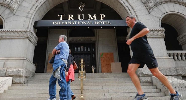 Plywood conceals spray paint on Trump International Hotel in Washington, D.C. after it was vandalized by Black Lives Matter. (Photo: AP)