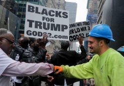 A construction worker exchanges a fist bump with pro-Trump supporters who gathered to cheer his election as President, Nov. 9, 2016, outside Trump Tower in New York. (Photo: AP/Associated Press)