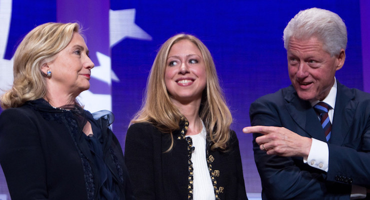 Former President Bill Clinton, right, stands on stage with then-Secretary of State Hillary Rodham Clinton, left, and their daughter Chelsea Clinton during the closing Plenary session of the seventh Annual Meeting of the Clinton Foundation, or the Clinton Global Initiative, on September 22 in New York City. (Photo: Reuters)