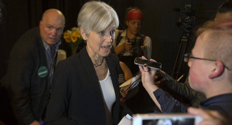 Green party presidential candidate Jill Stein, center, takes questions from reporters during a campaign stop at Humanist Hall in Oakland, Calif. on Thursday, Oct. 6, 2016. (Photo: AP)