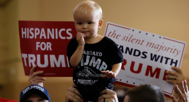 An adorable child is held up before Republican presidential nominee Donald Trump attends a campaign rally in at the Florida State Fairgrounds in Tampa, Florida, on November 5, 2016. (Photo: REUTERS/Carlo Allegri)