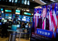 U.S. President-elect Donald Trump is seen speaking on a television on the floor of the New York Stock Exchange (NYSE) in New York, U.S., on Wednesday, Nov. 9, 2016. U.S. stocks fluctuated in volatile trading in the aftermath of Trump's surprise presidential election win, as speculation the Republican will pursue business-friendly policies offset some of the broader uncertainty surrounding his ascent. Photographer: Michael Nagle/Bloomberg
