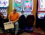 Frank Osysko waits at a slot machine before a rally for Republican presidential candidate Donald Trump on Thursday, Jan. 21, 2016, in Las Vegas. (AP Photo/Isaac Brekken)