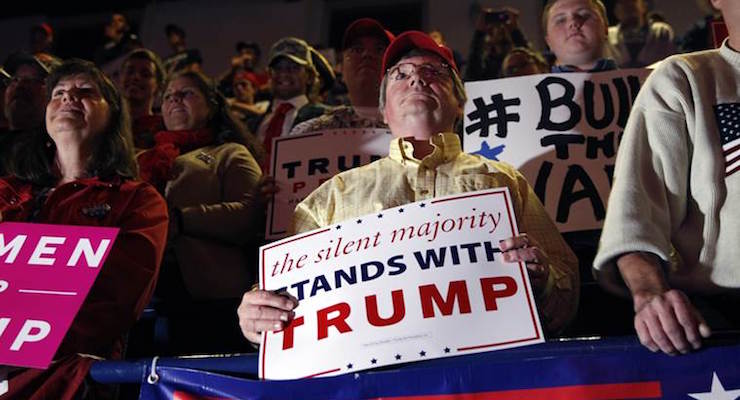 People hold signs during a campaign rally for Republican presidential candidate Donald Trump Monday, Nov. 7, 2016, in Scranton, Pennsylvania. (Photo: AP)