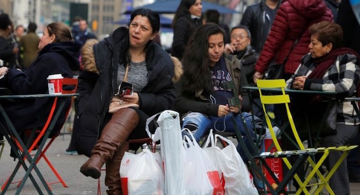 A woman sits in Herald Square with bags of shopping during Black Friday sales in Manhattan, New York, U.S., November 25, 2016. (Photo: REUTERS)