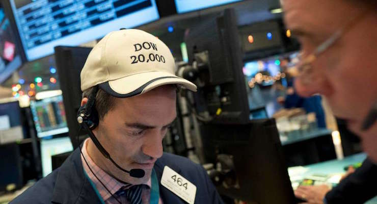 Gregory Rowe follows stock prices at the New York Stock Exchange, Wednesday, Dec. 21, 2016, in New York. The Dow is close to the 20,000 mark. (Photo: AP)