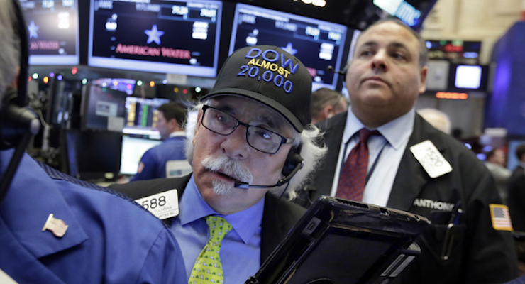 Trader Peter Tuchman wears his "Dow Almost 20,000" cap as he works on the floor of the New York Stock Exchange, Thursday, Dec. 15, 2016. Stocks are opening moderately higher on Wall Street and the dollar is making more gains against other currencies a day after the Federal Reserve raised its benchmark interest rate. (Photo: AP)