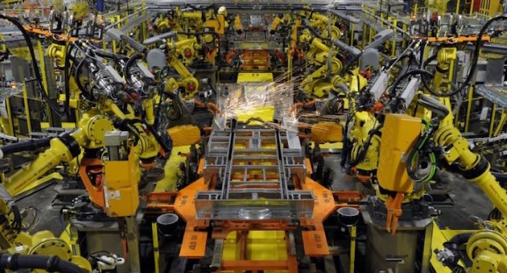 FILE PHOTO - Robotic arms spot welds on the chassis of a Ford Transit Van under assembly at the Ford Claycomo Assembly Plant in Claycomo, Missouri April 30, 2014. (Photo: REUTERS)