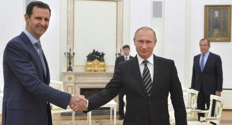 FILE - In this Oct. 20, 2015 file photo, Russian President Vladimir Putin, center, shakes hand with Syrian President Bashar Assad as Russian Foreign Minister Sergey Lavrov, right, looks on, at the Kremlin, in Moscow, Russia. For five years fighting has raged in Syria -- a globally resonant nightmare kept going in part by the insistence of Bashar Assad’s opponents that he must go even though they were failing to dislodge him from power. Now an inflection point may finally be at hand, with increasingly important Turkey suggesting Assad could play a role in an unspecified transition period. (Photo: Kremlin Pool Photo via AP, File)