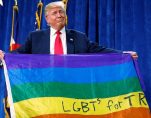 Then-presidential candidate Donald J. Trump holds up a rainbow flag with LGBTs for Trump written on it at a rally in Greeley, Colorado. (Photo: Reuters)