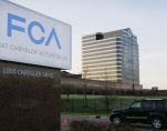 In this photo taken on Tuesday, May 6, 2014, a vehicle drives past a sign outside the Fiat Chrysler Automobiles world headquarters in Auburn Hills, Michigan. (Photo: AP)