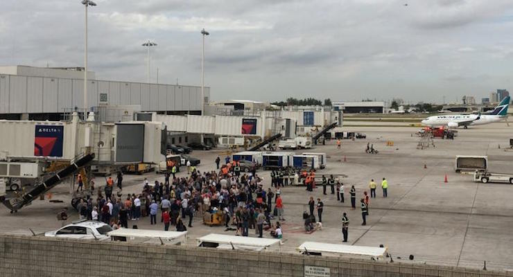 Travelers are evacuated out of the terminal and onto the tarmac after airport shooting at Fort Lauderdale-Hollywood International Airport. (Photo: Reuters)