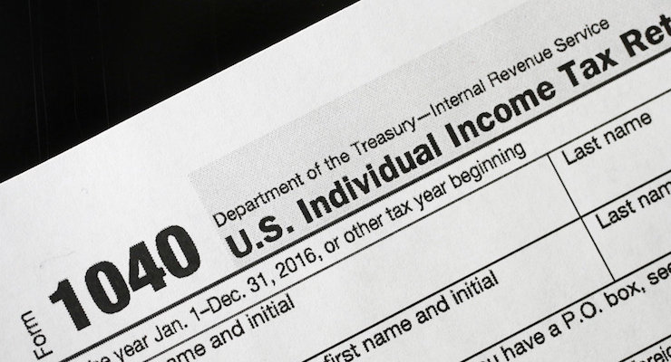 A 1040 tax form appears on display, Tuesday, Jan. 10, 2017, in New York. (Photo: AP)