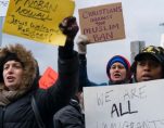 Protesters assemble at JFK Airport after two Iraqi refugees were detained.
