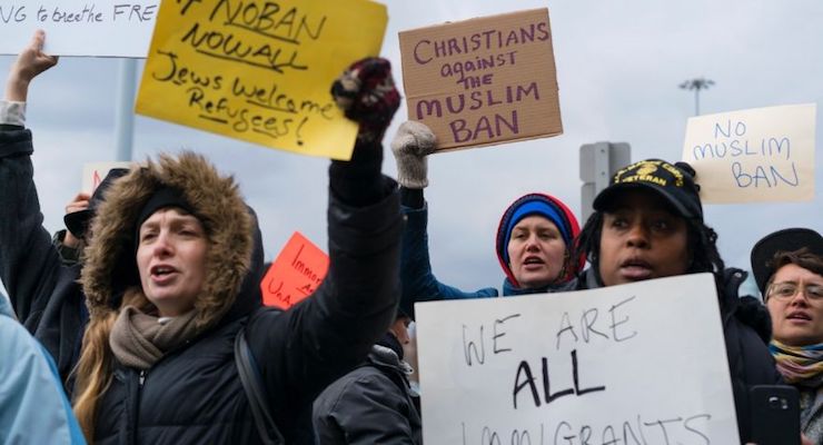 Protesters assemble at JFK Airport after two Iraqi refugees were detained.