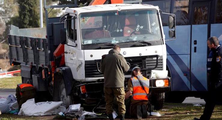 Israeli soldiers work at the scene where police said a Palestinian rammed his truck into a group of Israeli soldiers on a popular promenade in Jerusalem January 8, 2017. (Photo: Reuters)