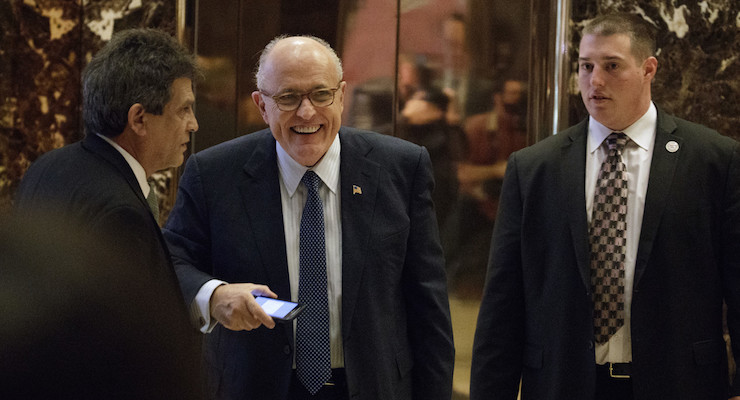 Former New York Mayor Rudy Giuliani, center, smiles as he leaves Trump Tower, Friday, Nov. 11, 2016, in New York. (Photo: AP)