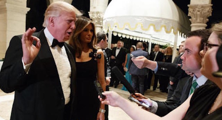 Melania Trump, right, looks on as her husband President-elect Donald Trump talks to reporters during a New Years Eve party at Mar-a-Lago, Saturday, Dec. 31, 2016, in Palm Beach, Fla. (Photo: AP)