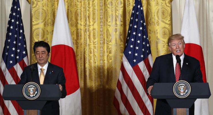 Japanese Prime Minister Shinzō Abe, left, looks on as U.S. President Donald J. Trump, right, speaks during a joint press conference at the White House in Washington, U.S., February 10, 2017.