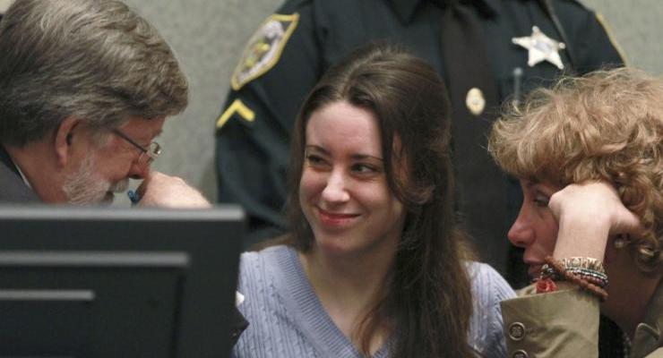 Casey Anthony (C) smiles at Defense Counsel Cheney Mason and Dorothy Clay Sims.