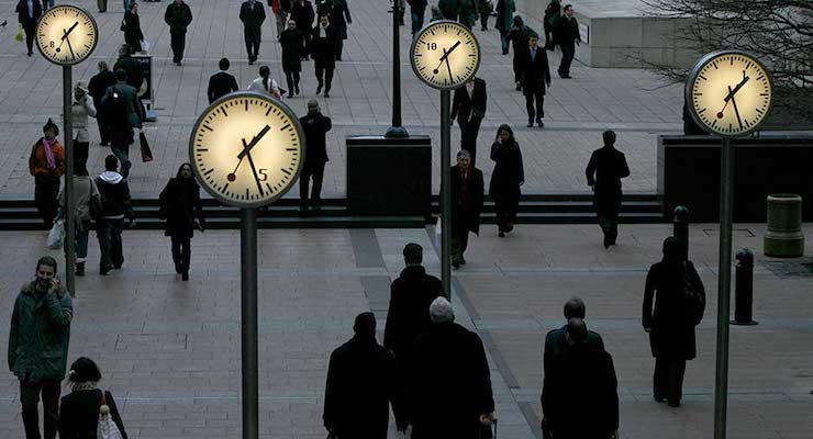 Pedestrians walk through the Canary Wharf financial district of London January 16, 2009.