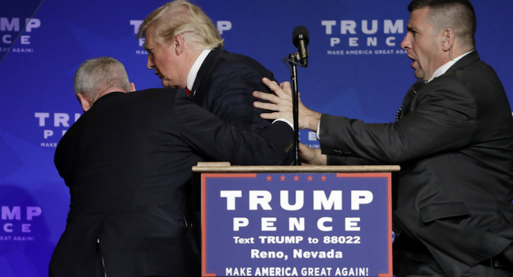 President Donald J. Trump is rushed off the stage by Secret Service agents after an immigrant from England threatened to kill him.