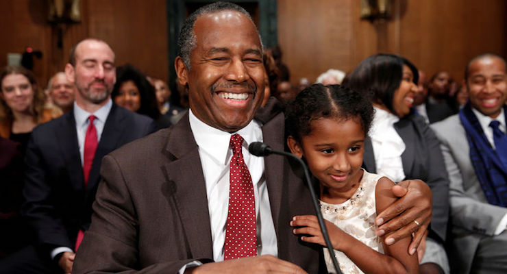 Dr. Ben Carson gets a hug from his granddaughter Tesora as he takes his seat to testify before a Senate Banking, Housing and Urban Affairs Committee confirmation hearing on his nomination to be Secretary of the U.S. Department of Housing and Urban Development on Capitol Hill in Washington, January 12, 2017. (Photo: Reuters)