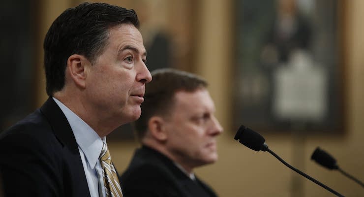 FBI Director James Comey, left, accompanied by National Security Agency Director Michael Rogers, testifies on Capitol Hill in Washington Monday. (Photo: AP)