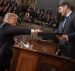 President Donald J. Trump, left, shakes hands with House Speaker Paul Ryan, R-Wis., right, before his address to a joint session of Congress.