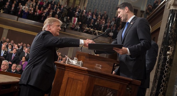 President Donald J. Trump, left, shakes hands with House Speaker Paul Ryan, R-Wis., right, before his address to a joint session of Congress.