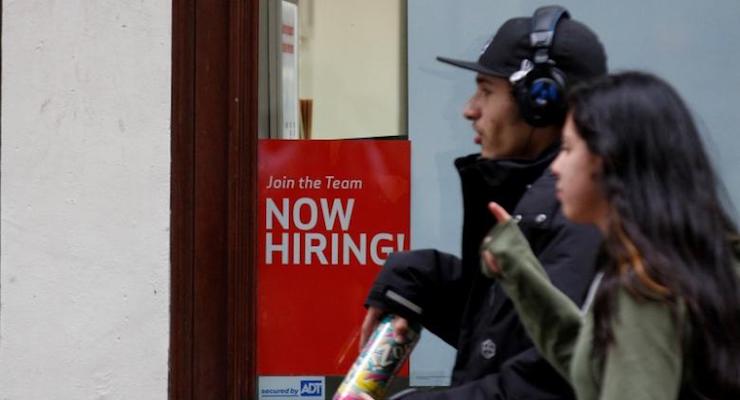People walk past a ''Now Hiring'' sign in Manhattan in New York City, U.S., May 10, 2016. (Photo: Reuters)