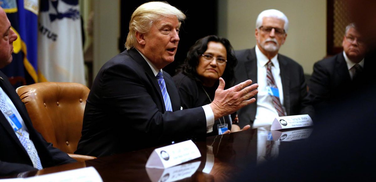 U.S. President Donald J. Trump (C), flanked by Gary Masino (L) of the Sheet Metal Workers Union, Telma Mata (2nd R) of the Heat and Frost Insulators Allied Workers Local 24 and United Brotherhood of Carpenters General President Doug McCarron (R), holds a roundtable meeting at the White House on Jan. 27. 2017. (Photo: Reuters)